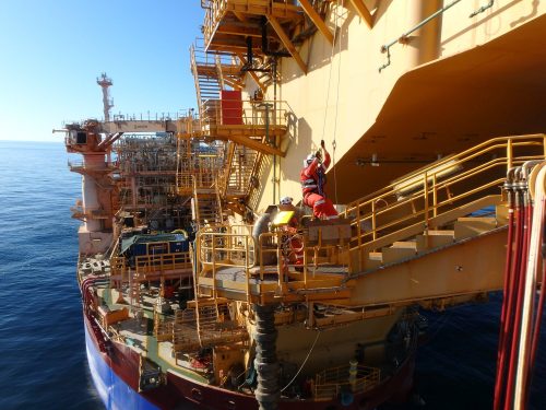 A rope access technician working above the water on an FPSO Riser turret mooring (RTM) offshore