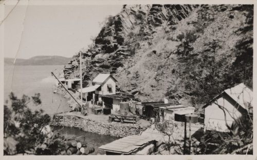A black and white image showing the view from above of a small settlement on the shores of Koolan Island, taken in the 1940s.