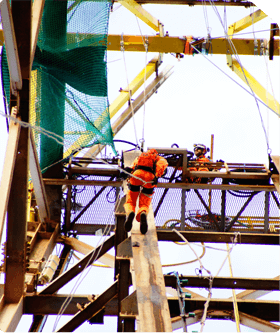 Catch netting and arrest netting on a derrick structure allowing multiple rope access inspection and trades teams to work simulataneously above each other